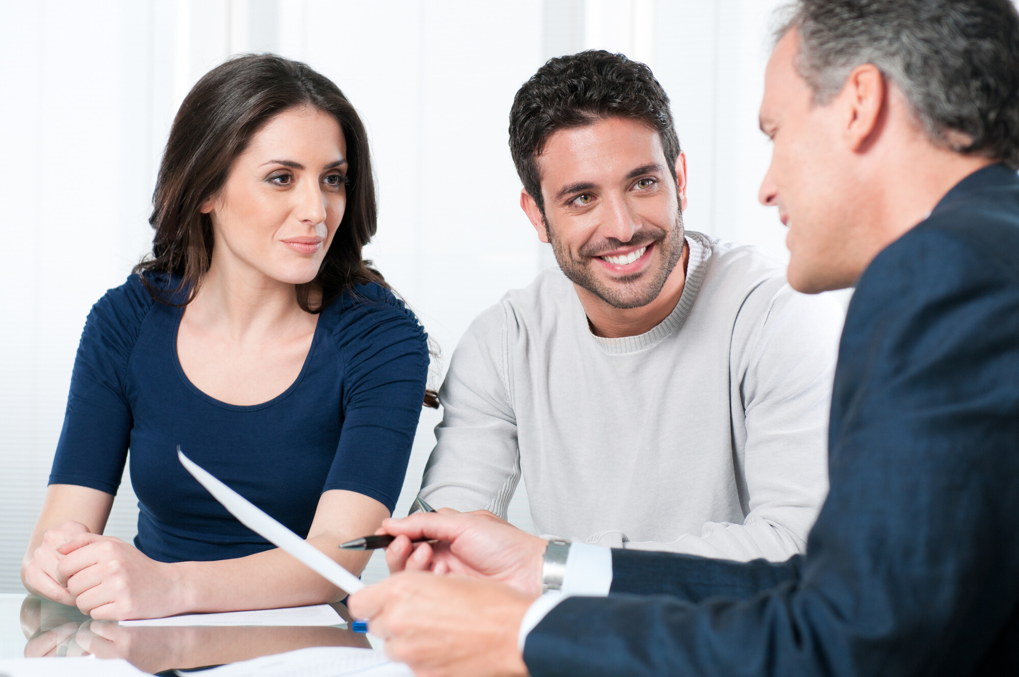 Couple reviewing a document with a consultant