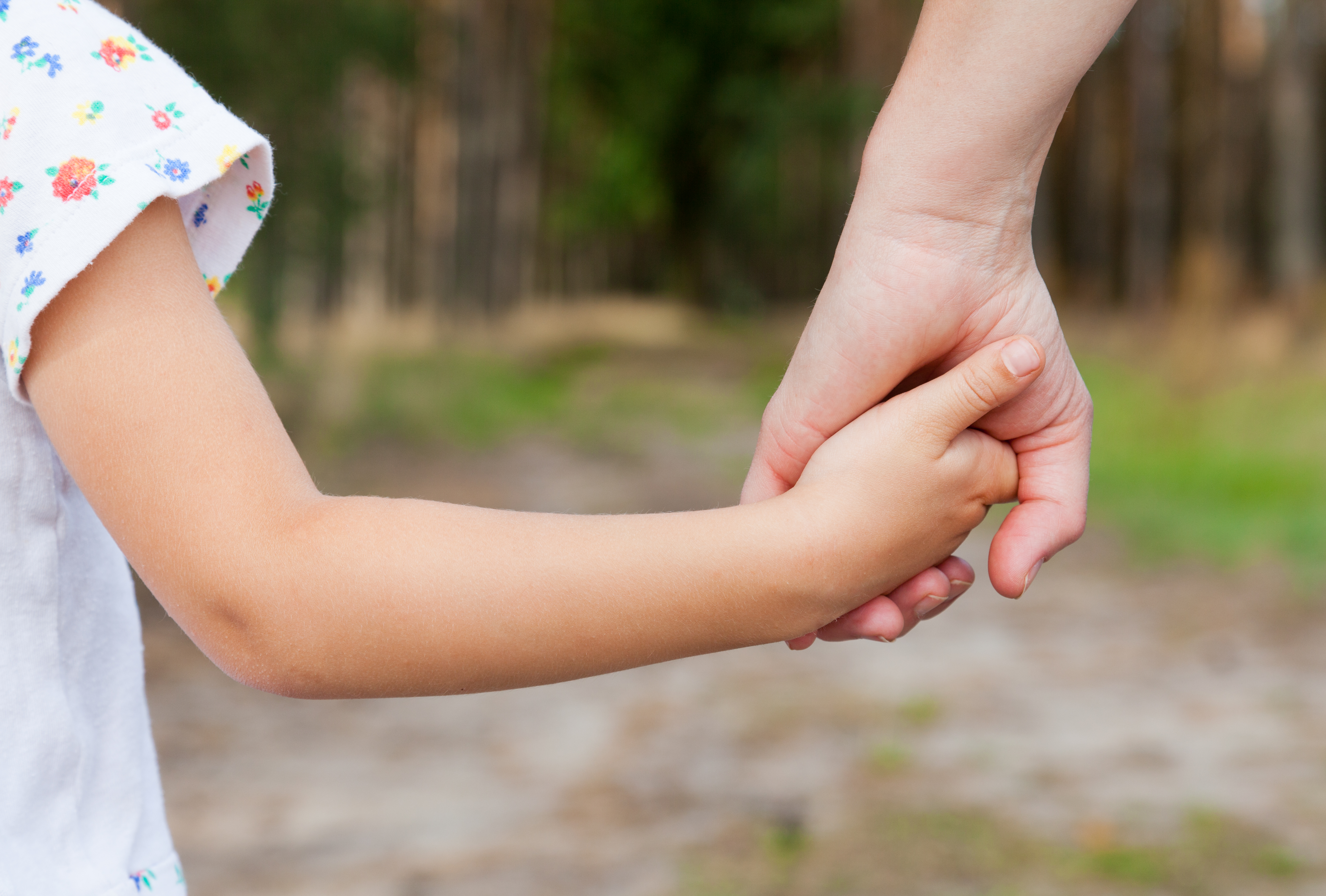 parent and child holding hands